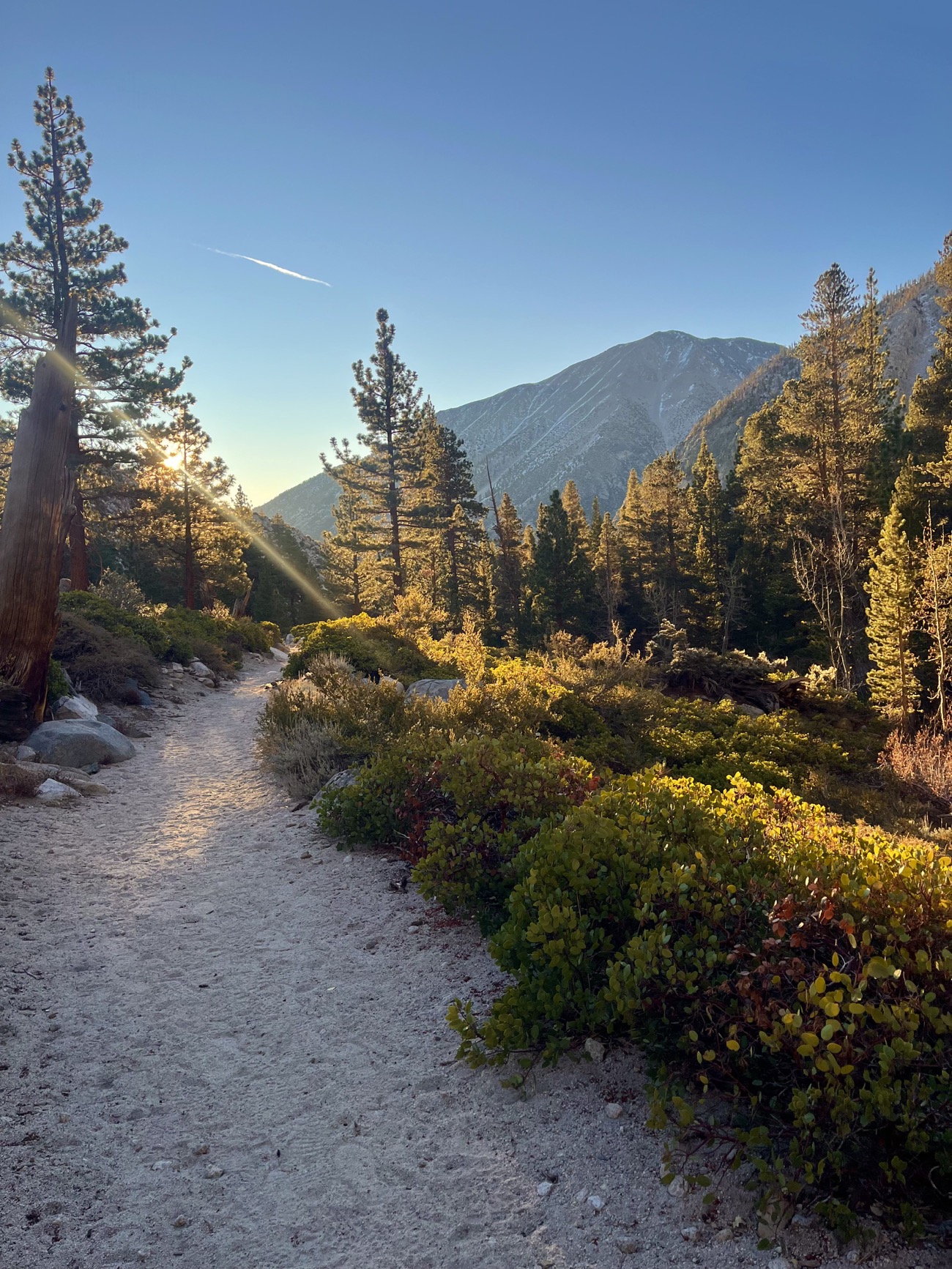 Sun peeking over mountains on the Big Pine Lakes Trail