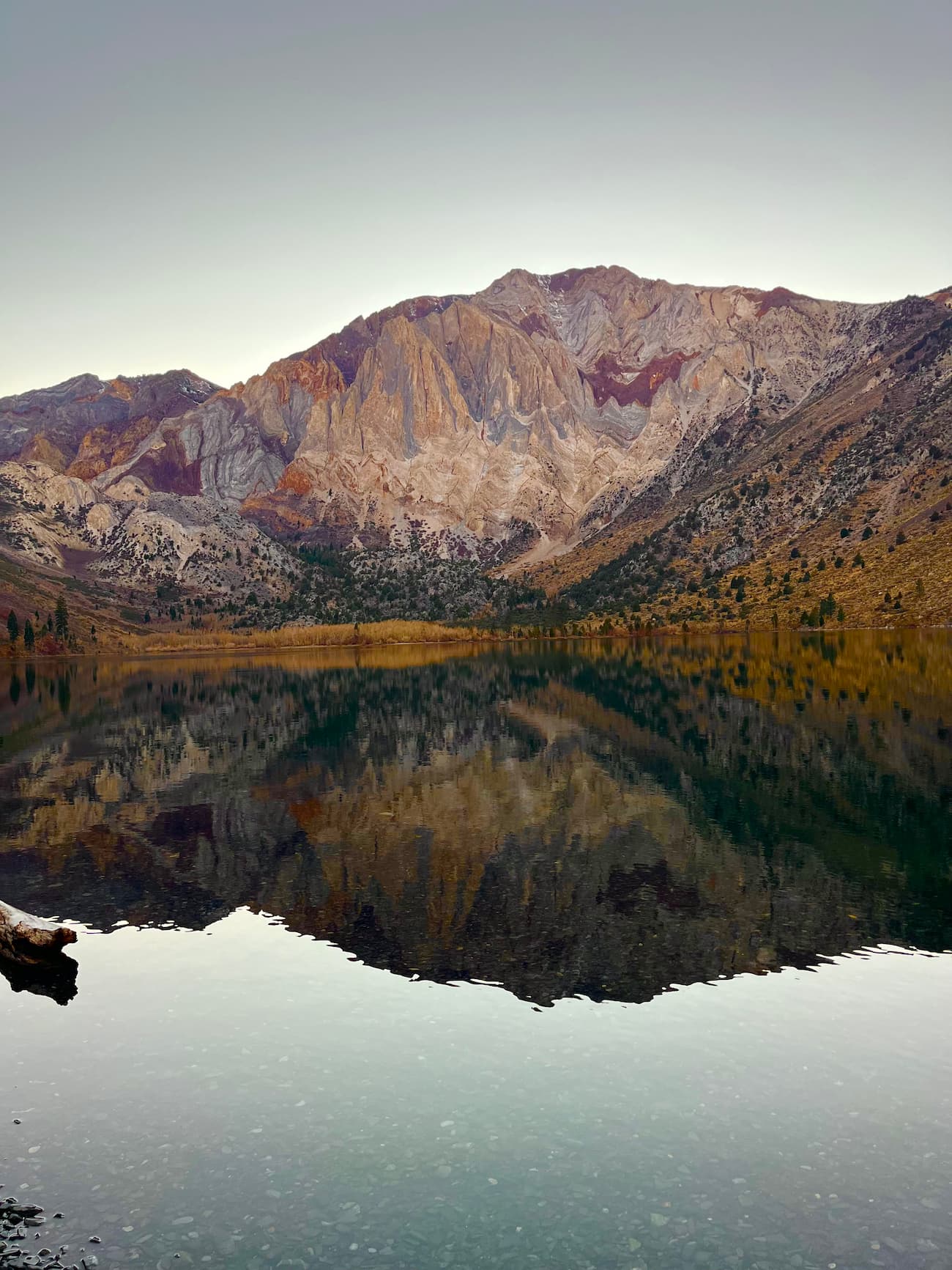 Convict Lake at sunset with Mount Morrison and evergreens in the background
